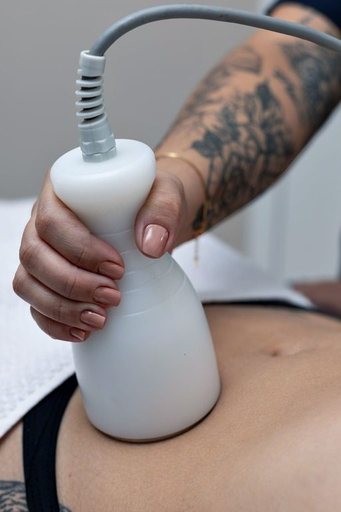 Onda body tightening treatment on abdomen